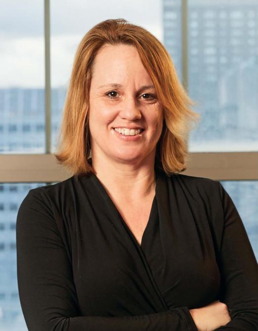 a woman smiling for a portrait